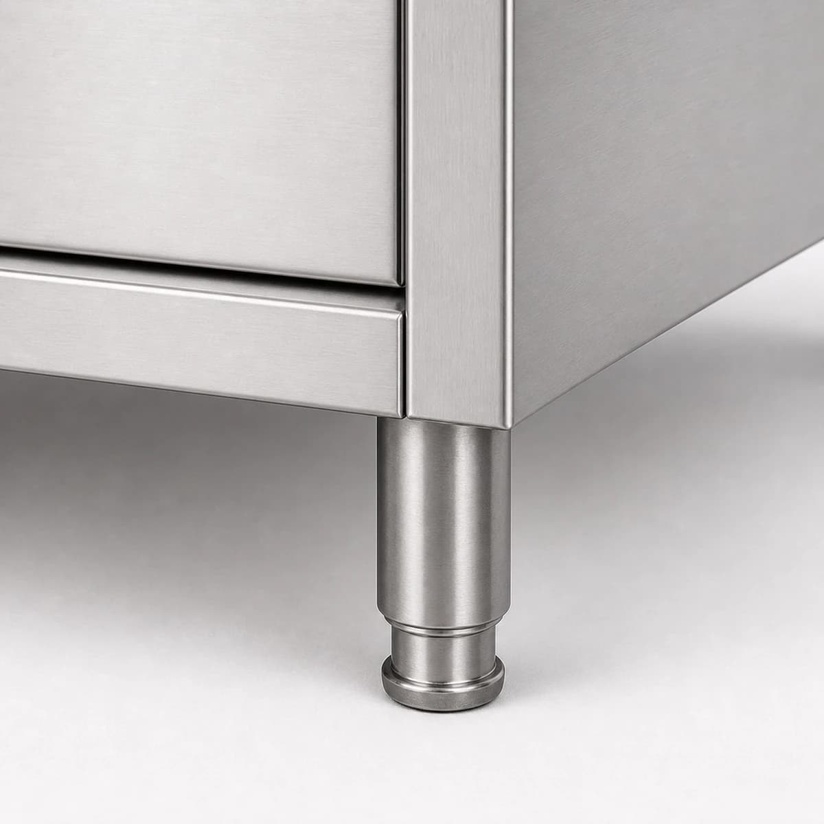 Close-up of an adjustable stainless steel cabinet foot