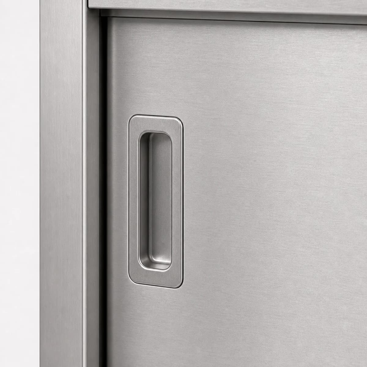 Close-up of a recessed stainless steel sliding door handle